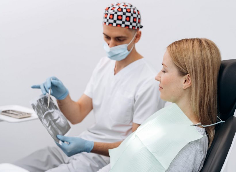 Dentist communicates with the patient.