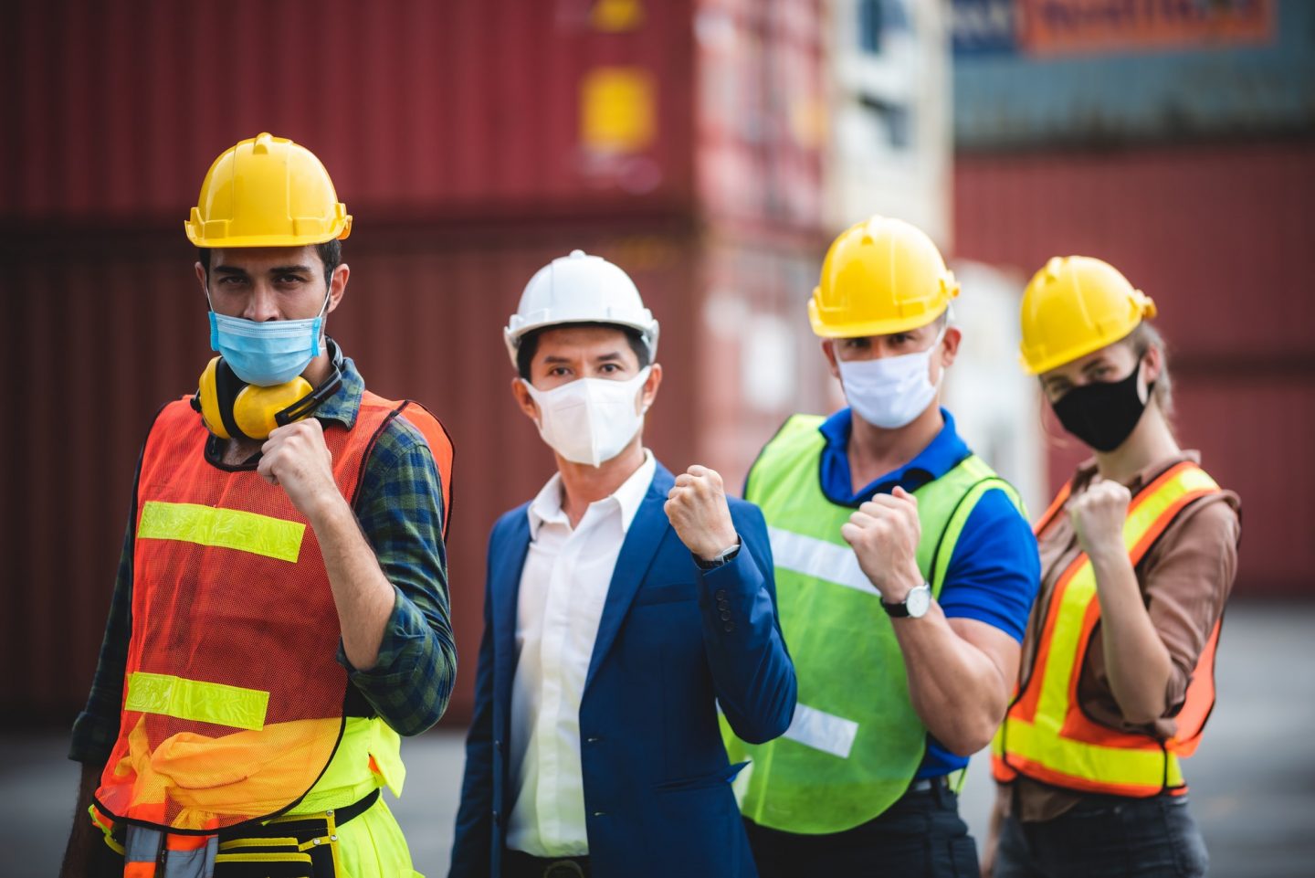 worker group with engineer, foreman, and manager are wearing medical protection face mask