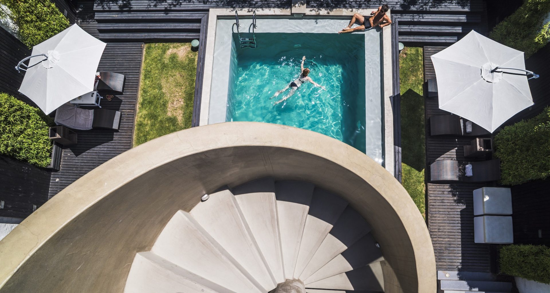 Couple at a swimming pool on vacation at luxury hotel accommodation, Santiago, Chile, South America