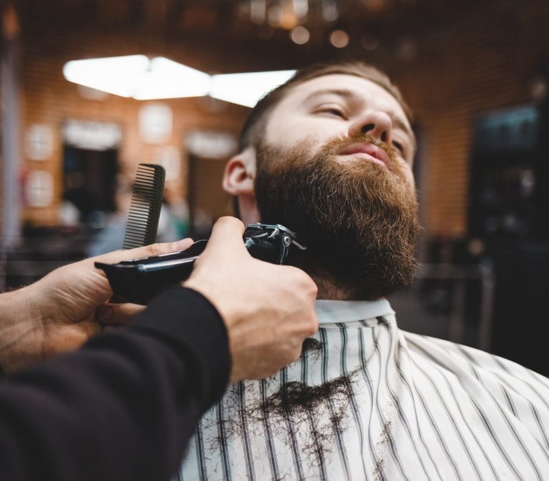 Barber cuts beard to a brutal guy