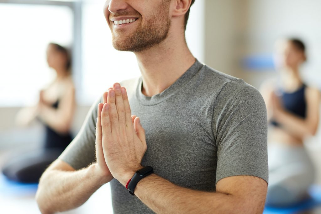 Greeting yoga teacher at class