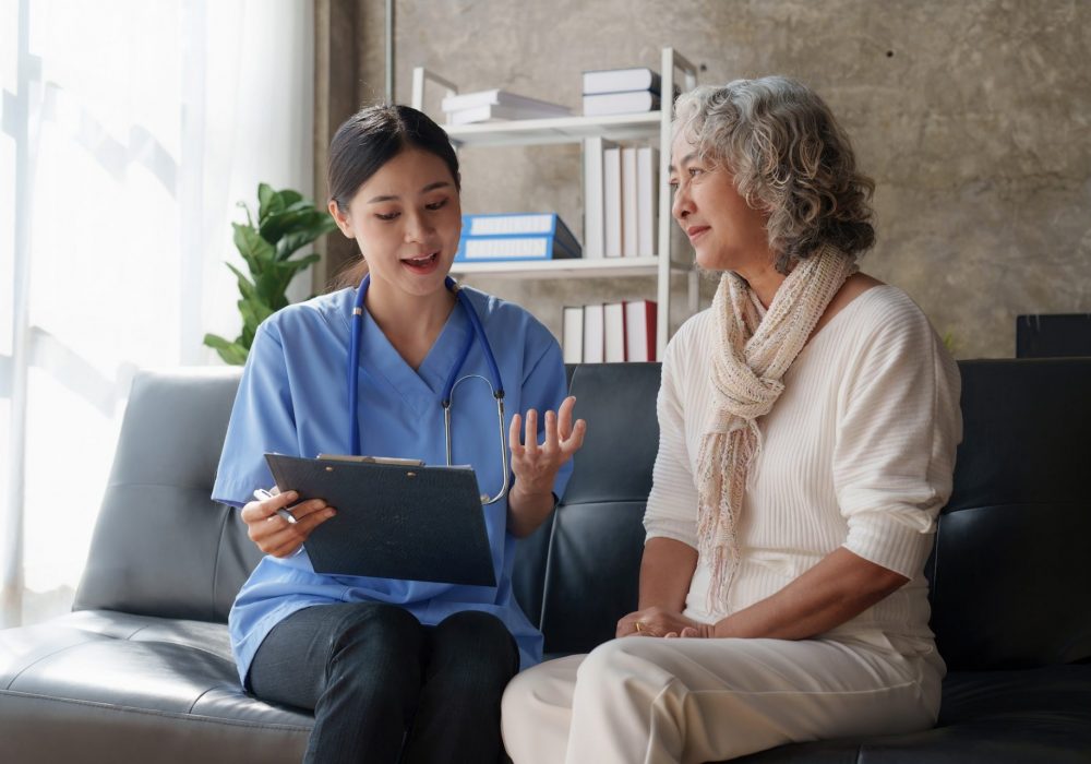 Home healthcare nurse, physical therapy with senior adult woman at home